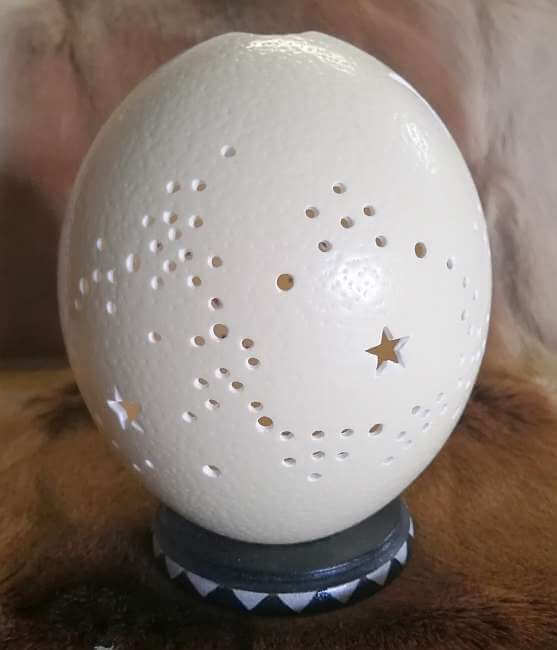Carved ostrich egg - Stars and candle