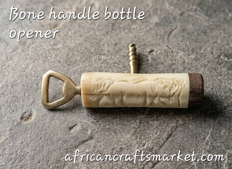African bone bottle opener - corkscrew A luxury African bar tool featuring a polished, hand-carved animal bone handle integrating both a bottle opener and a functional steel corkscrew