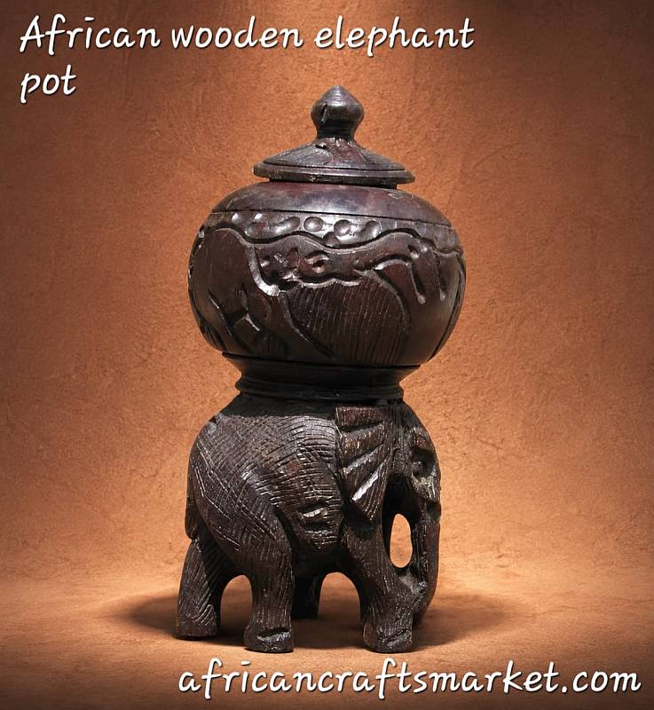 Hand-carved African elephant wooden storage box featuring detailed elephant figures supporting a lidded ironwood bowl.