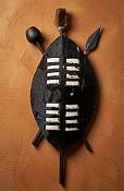 Small 35cm Zulu shield made from dark patterned Nguni cowhide, traditional African art piece sourced near Durban