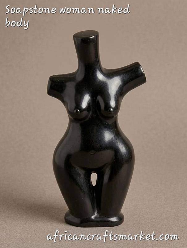 Abstract African Shona stone sculpture of a nude female form, hand-carved from highly polished dark serpentine stone with sweeping fluid lines