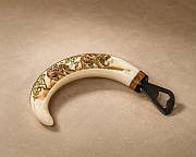 Warthog tusks bottle openers A premium selection of handcrafted African warthog tusk bottle openers showcasing the natural variation in ivory curves and polished brass caps