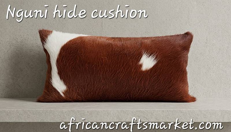 Brown and white Nguni cow hide bolster cushion Nguni cow hide bolster cushion - brown and white