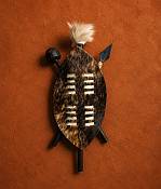 Handcrafted 25 cm Zulu warrior hide shield featuring traditional woven leather accents and a central wood support staff