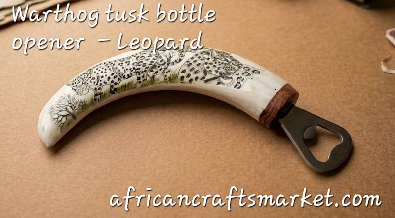 Warthog tusks bottle openers - Leopard Detailed black ink scrimshaw of a leopard’s face etched onto a polished genuine African warthog tusk bottle opener