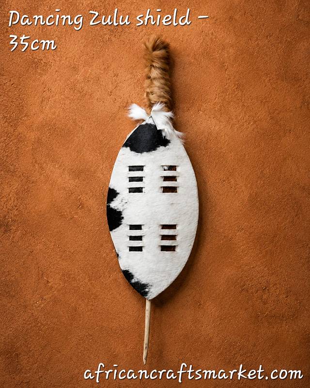 Authentic 35 cm Zulu dancing shield handcrafted from genuine Nguni cattle hide, featuring a central wooden handle for ceremonial dance