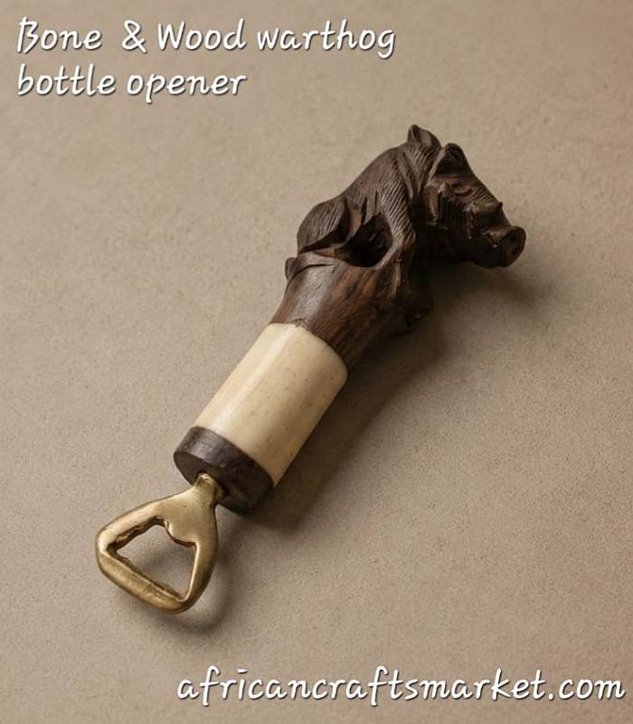 Handcrafted Wood and Bone Warthog Bottle Opener An authentic, handcrafted bottle opener featuring a detailed warthog head carved from rich wood and genuine bone